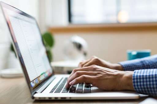 Worker on laptop Worker on laptop
