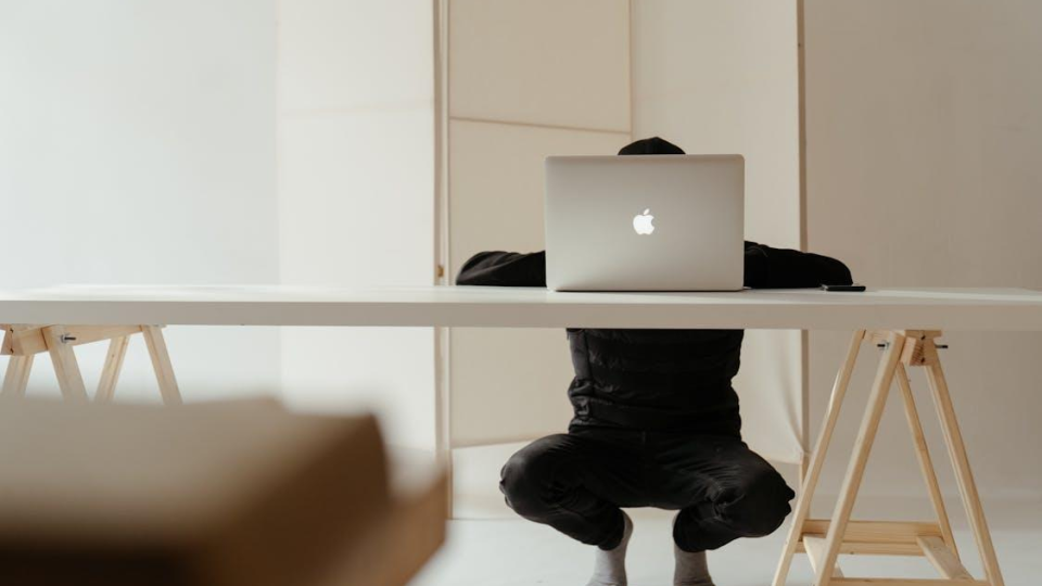 Silver macbook with white table